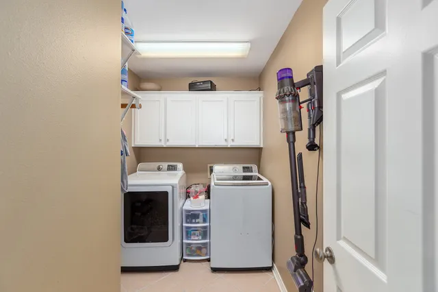a bedroom with a bed and a ceiling fan
