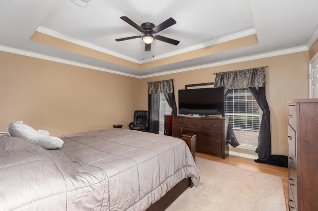 a bathroom with a tub shower and a sink