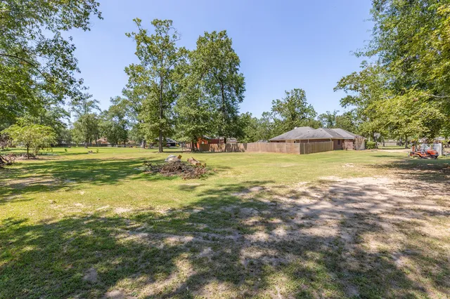 a view of a swimming pool with an outdoor space and seating area