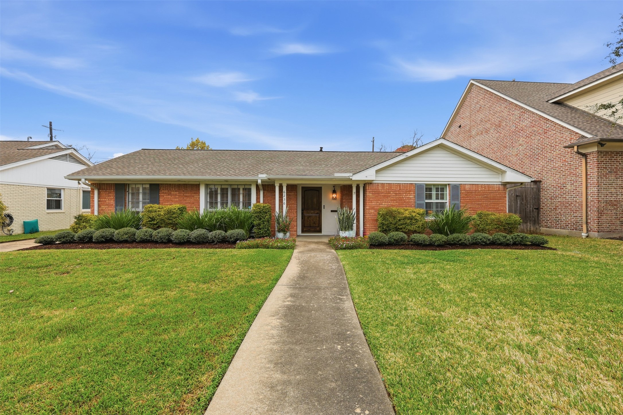 a front view of a house with yard