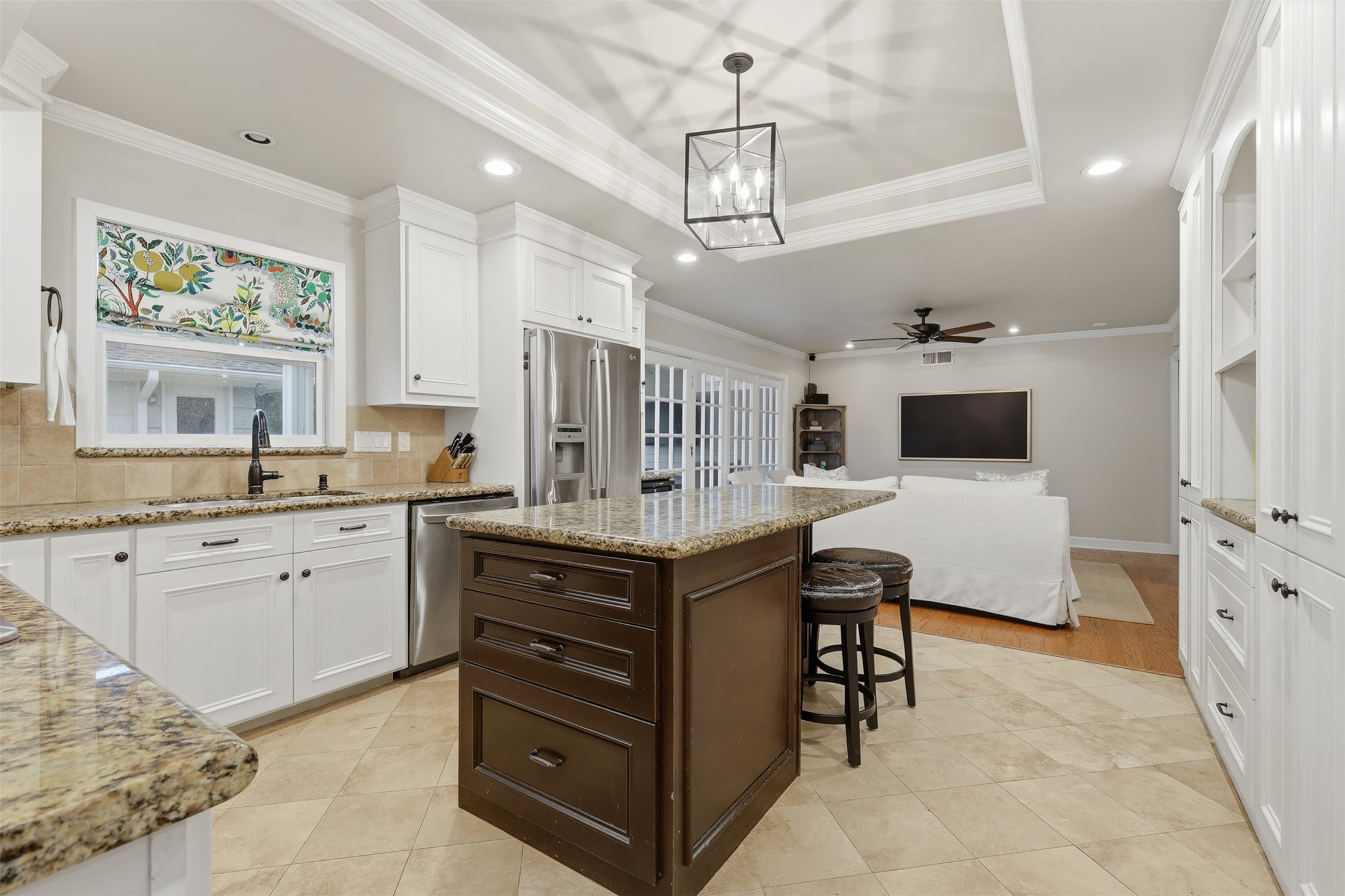 6236 Locke Lane Houston, TX 77057 - Photo 15 of 34 a spacious kitchen with stainless steel appliances granite countertop a stove oven and a refrigerator with white cabinets