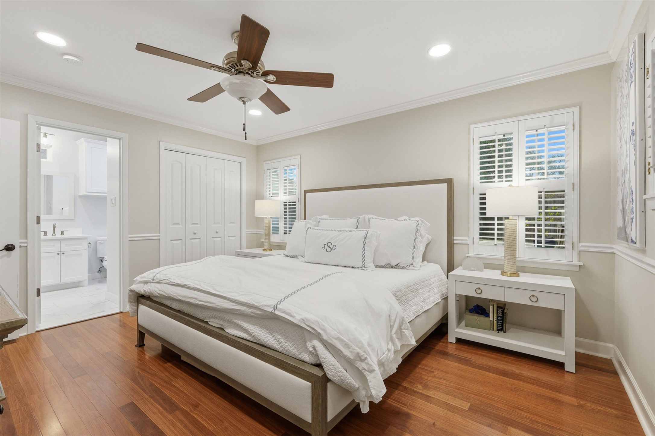 6236 Locke Lane Houston, TX 77057 - Photo 22 of 34 a bedroom with a bed and a chandelier