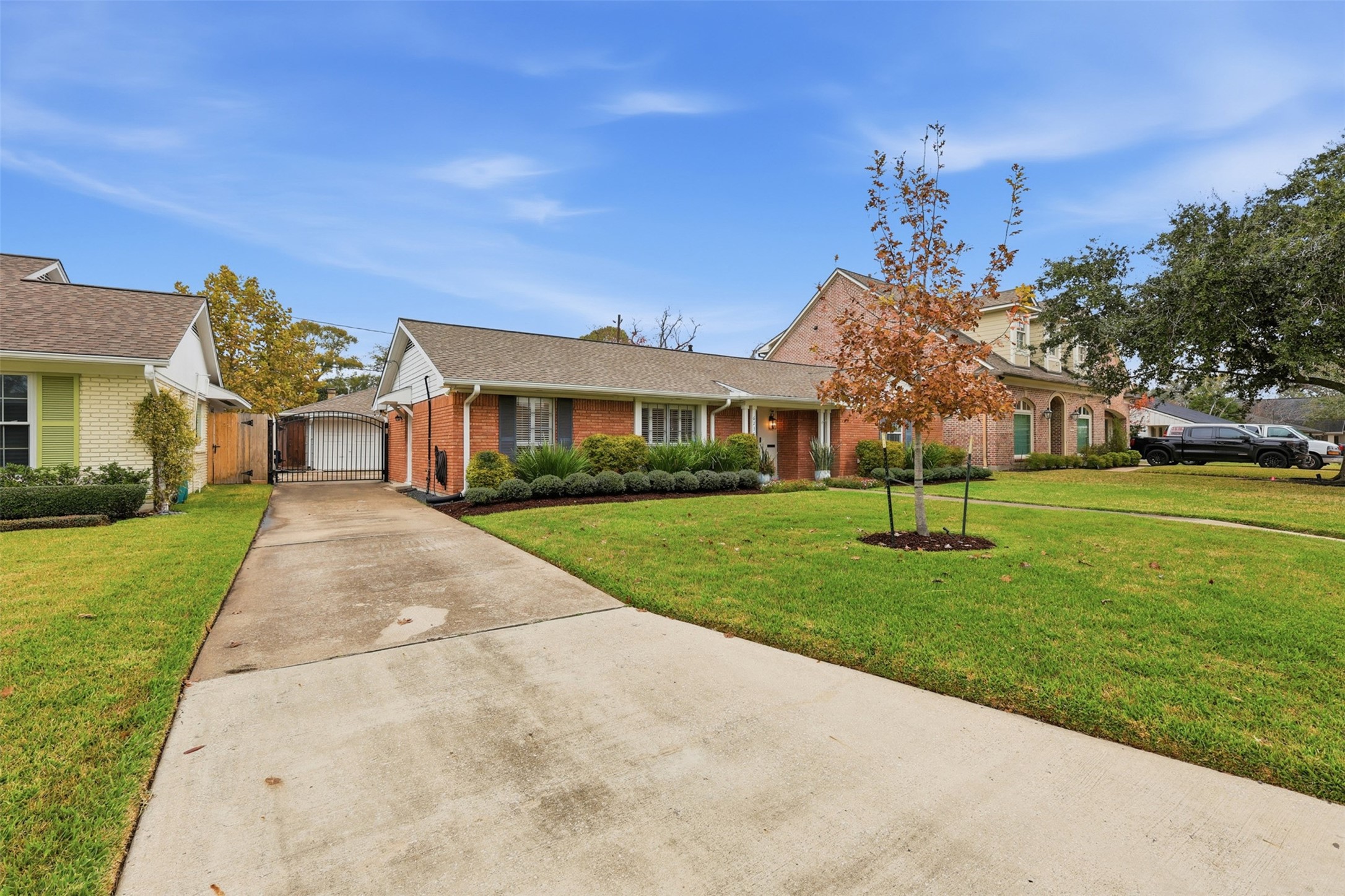 6236 Locke Lane Houston, TX 77057 - Photo 31 of 34 a front view of house with yard and green space