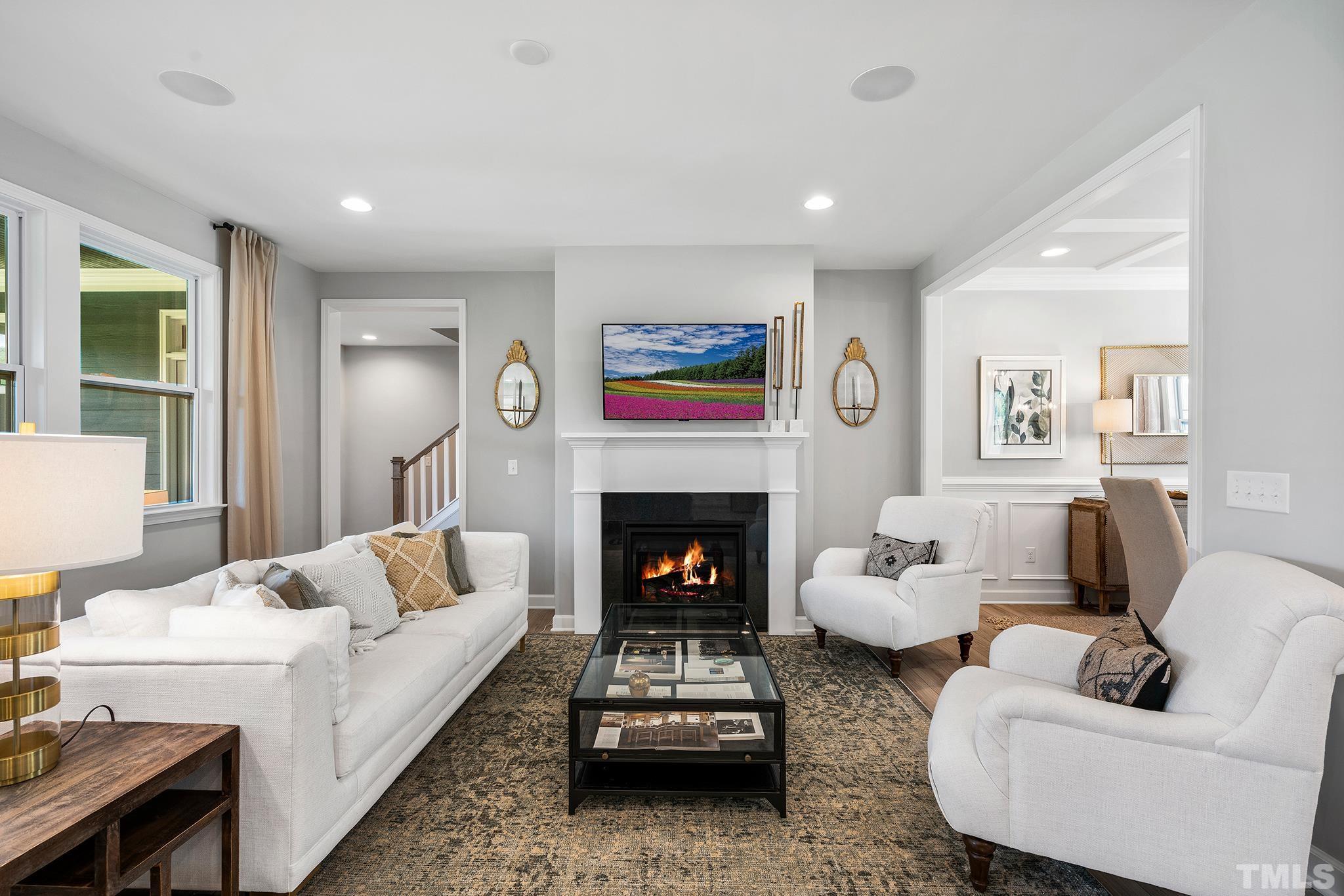 1016 Manchaca Loop, Unit 4 Apex, NC 27539 - Photo 13 of 36 a living room with furniture and a fireplace