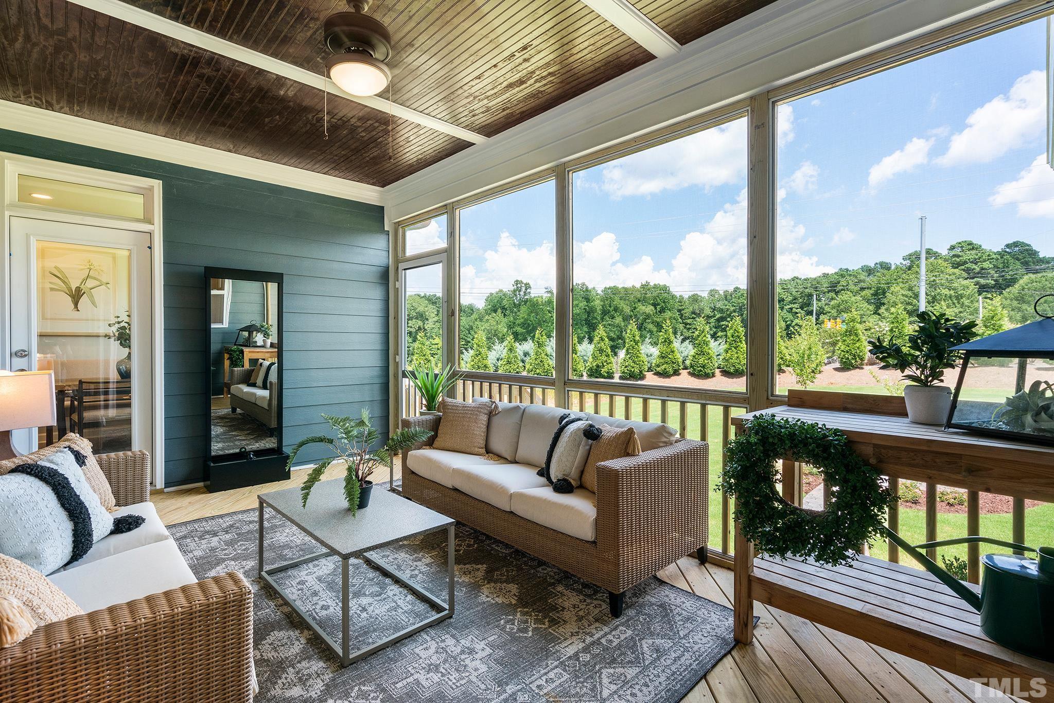 1016 Manchaca Loop, Unit 4 Apex, NC 27539 - Photo 15 of 36 a living room with furniture and a large window