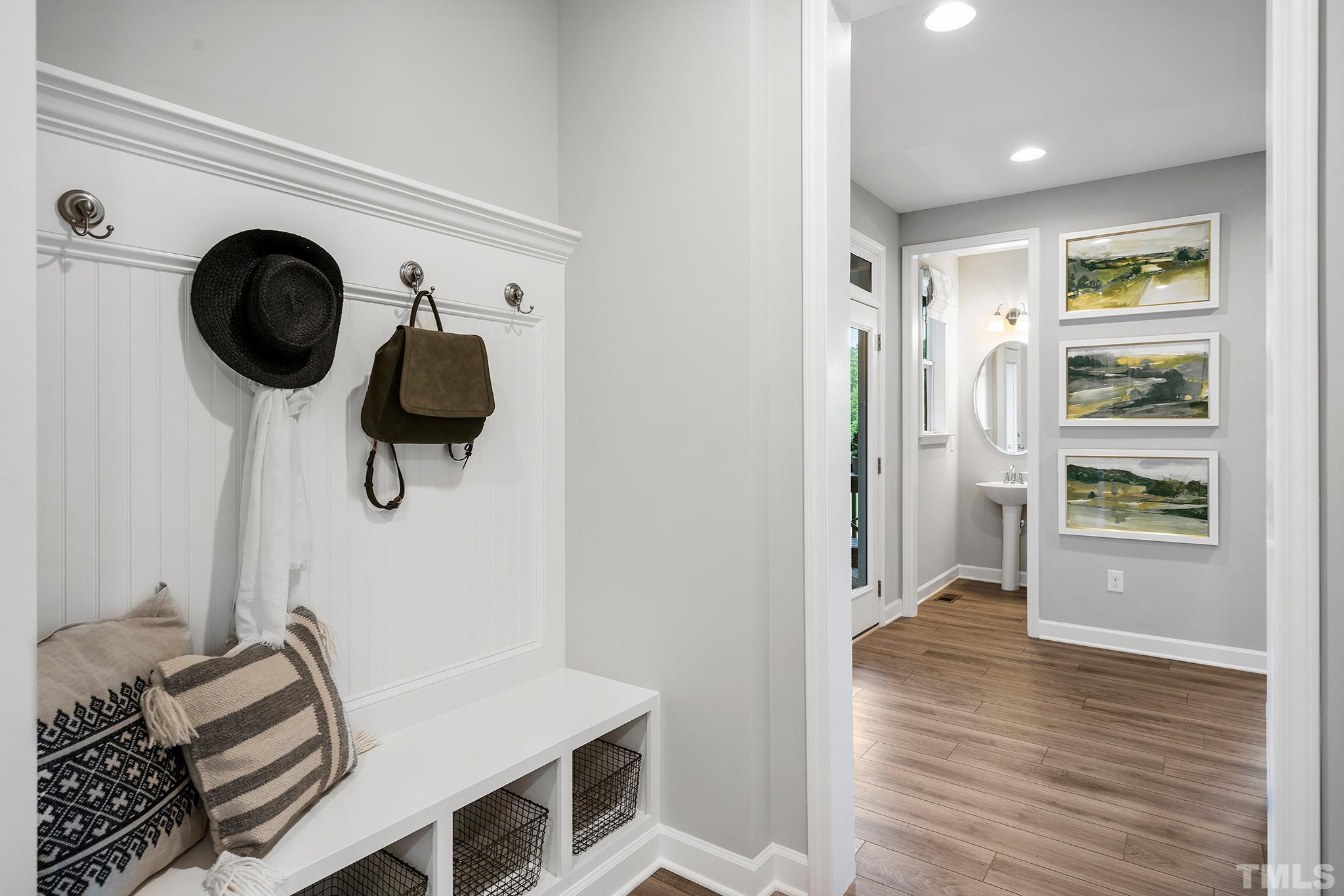 1016 Manchaca Loop, Unit 4 Apex, NC 27539 - Photo 18 of 36 a view of a kitchen with wooden floor and windows