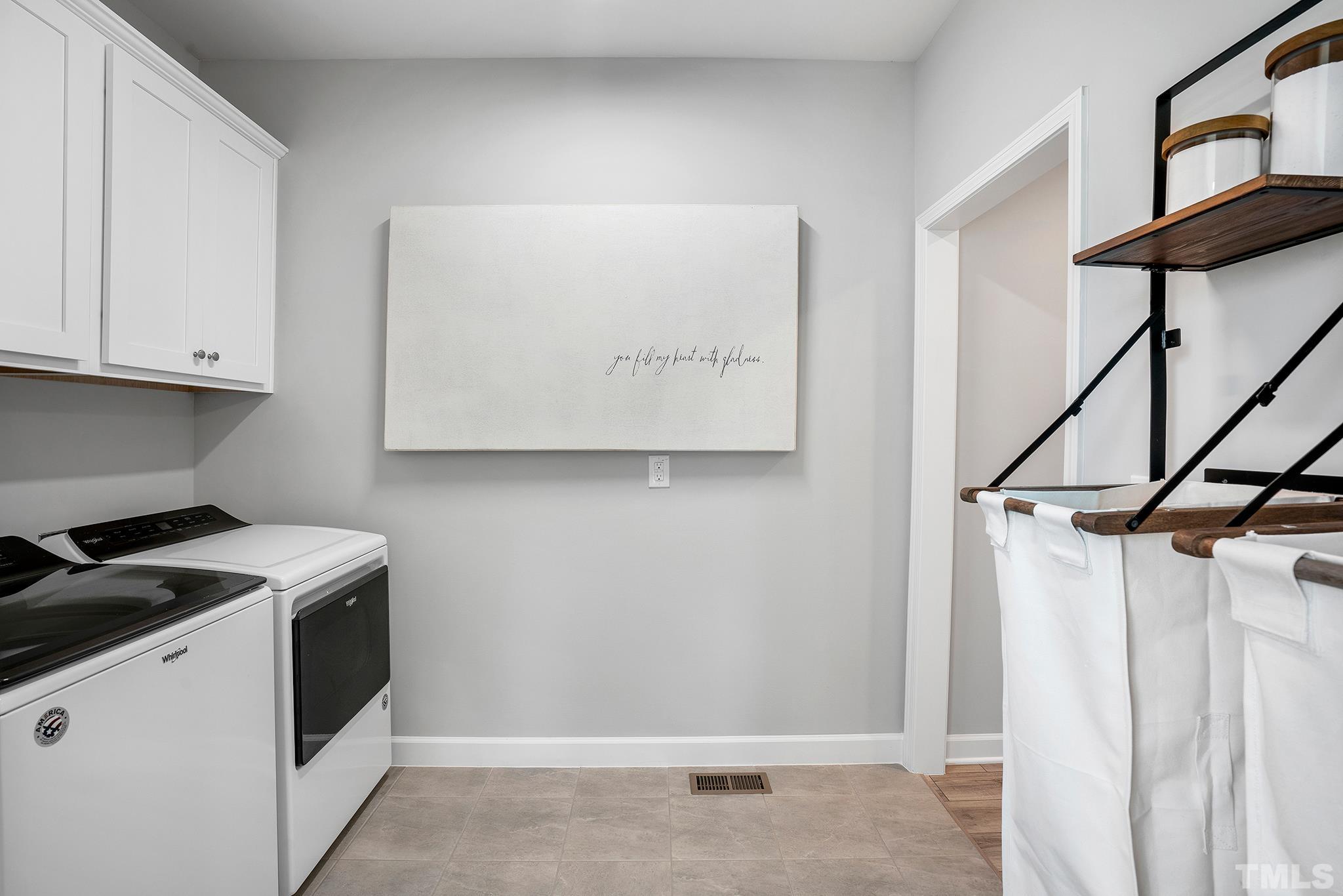 1016 Manchaca Loop, Unit 4 Apex, NC 27539 - Photo 24 of 36 a utility room with dryer and washer