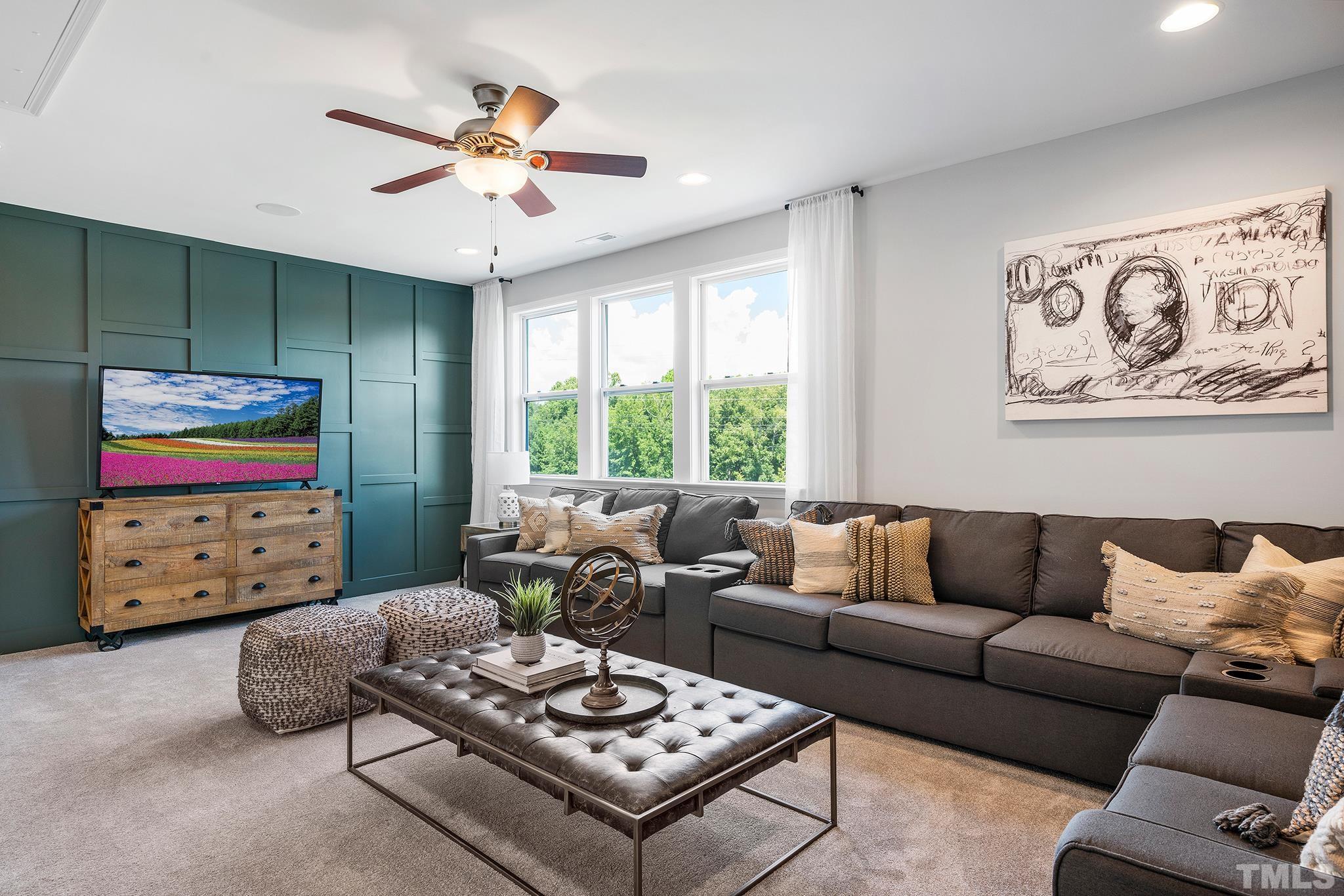 1016 Manchaca Loop, Unit 4 Apex, NC 27539 - Photo 25 of 36 a living room with furniture and a window