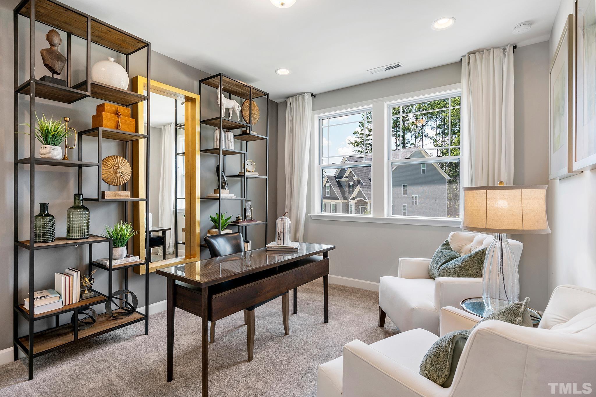 1016 Manchaca Loop, Unit 4 Apex, NC 27539 - Photo 26 of 36 a living room with furniture and a window