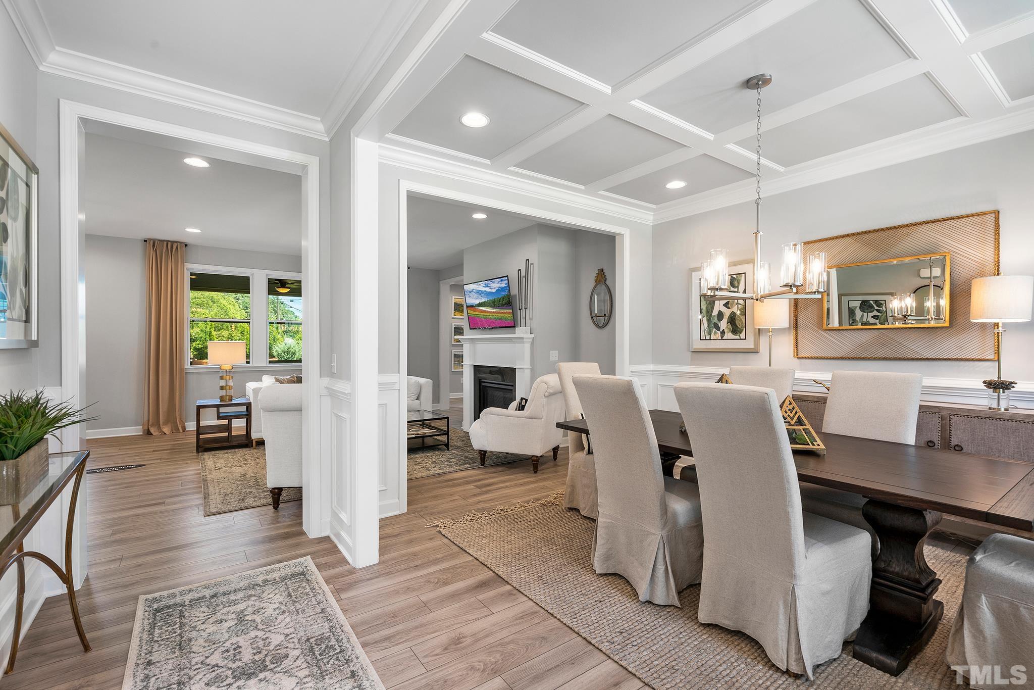 1016 Manchaca Loop, Unit 4 Apex, NC 27539 - Photo 8 of 36 a living room with lots of furniture and painting on the wall