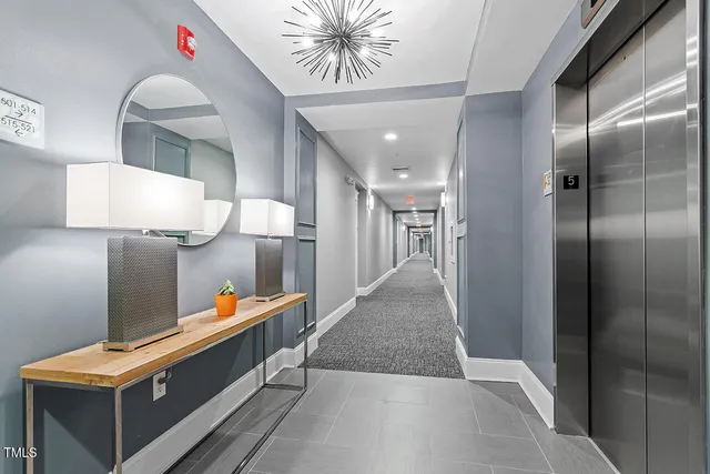 a large kitchen with stainless steel appliances kitchen island granite countertop a large center island attached withe living room