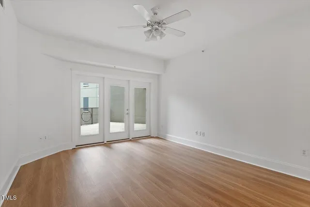 wooden floor in an empty room with a window