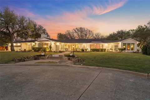 a view of an house with outdoor space and sitting area