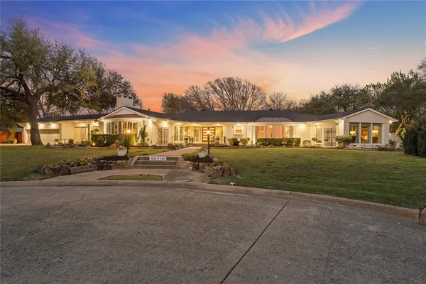 a view of an house with outdoor space and sitting area