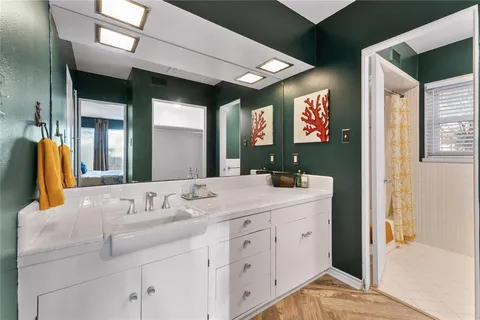 a bathroom with a sink and a mirror