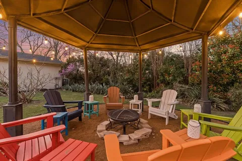 a view of a house with a yard porch and sitting area