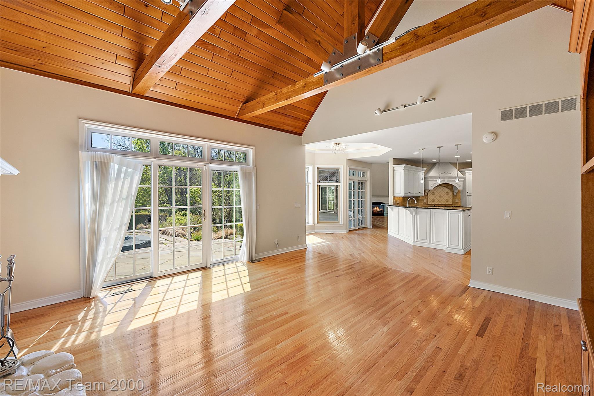 630 Sheldon Court Rochester, MI 48306 - Photo 37 of 94 Unfurnished living room with light wood finished floors and a high wooden beamed ceiling