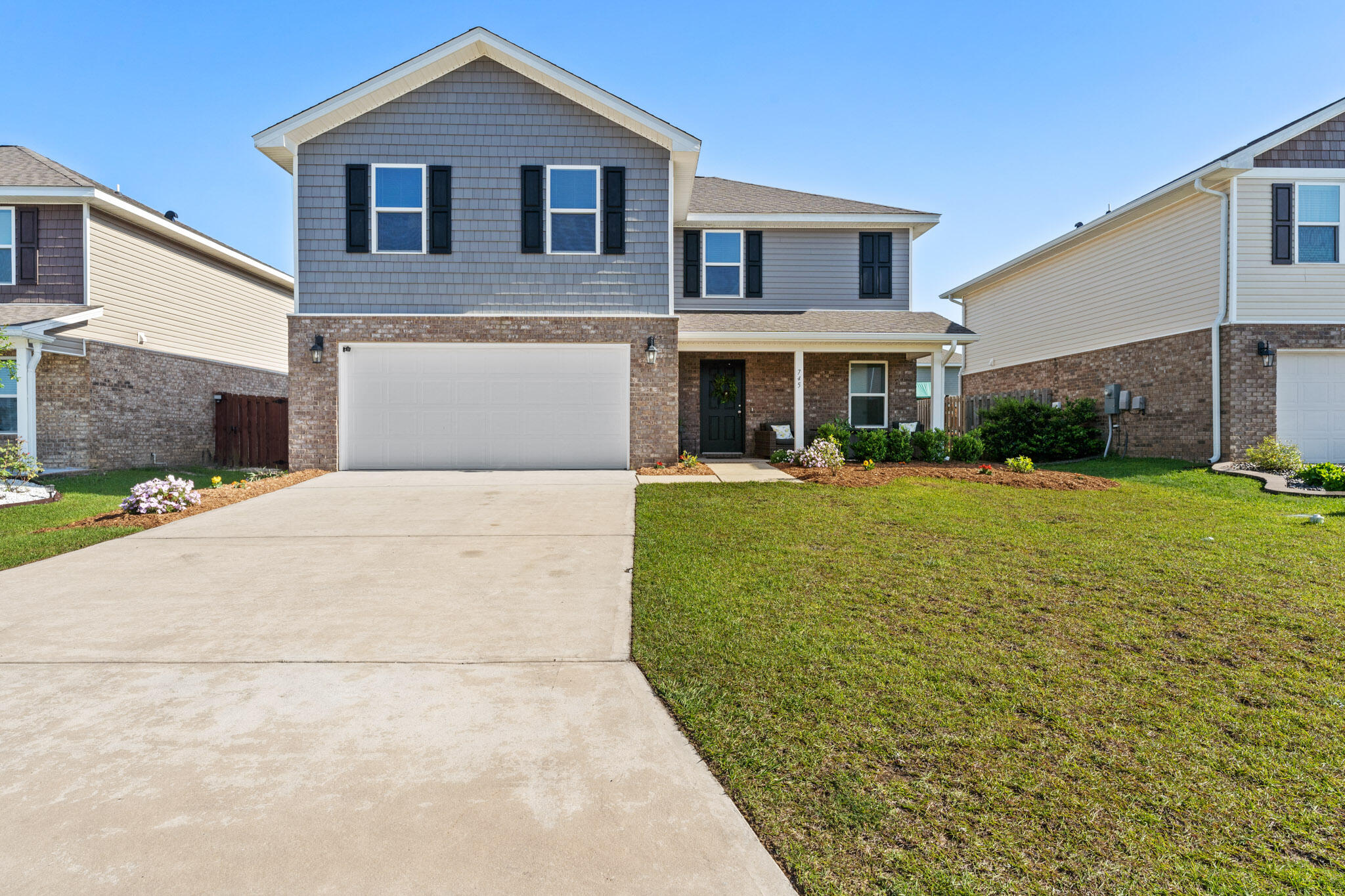 a front view of house with yard