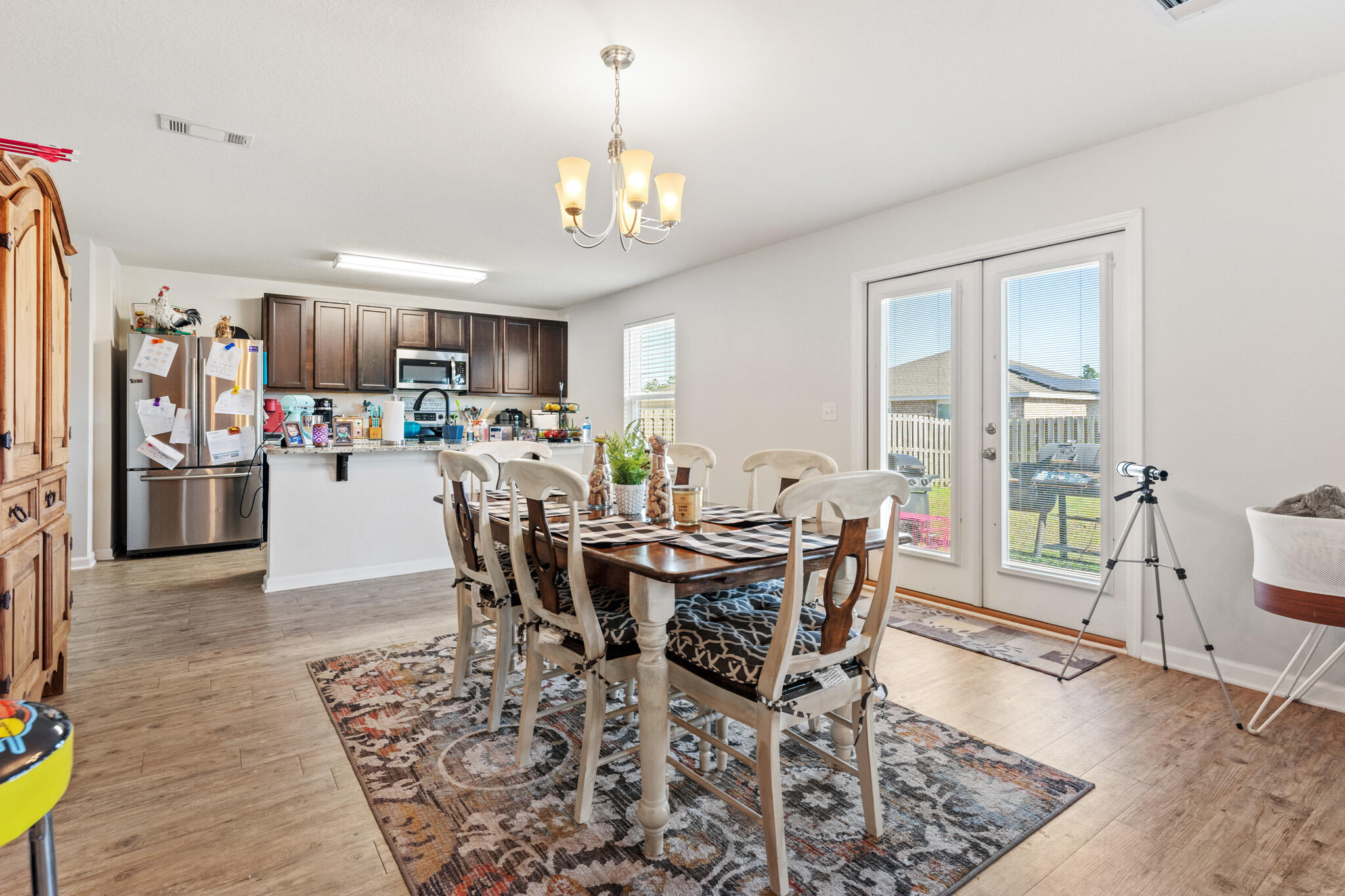 745 Widgeon Way Crestview, FL 32539 - Photo 11 of 29 a view of a dining room with furniture and wooden floor