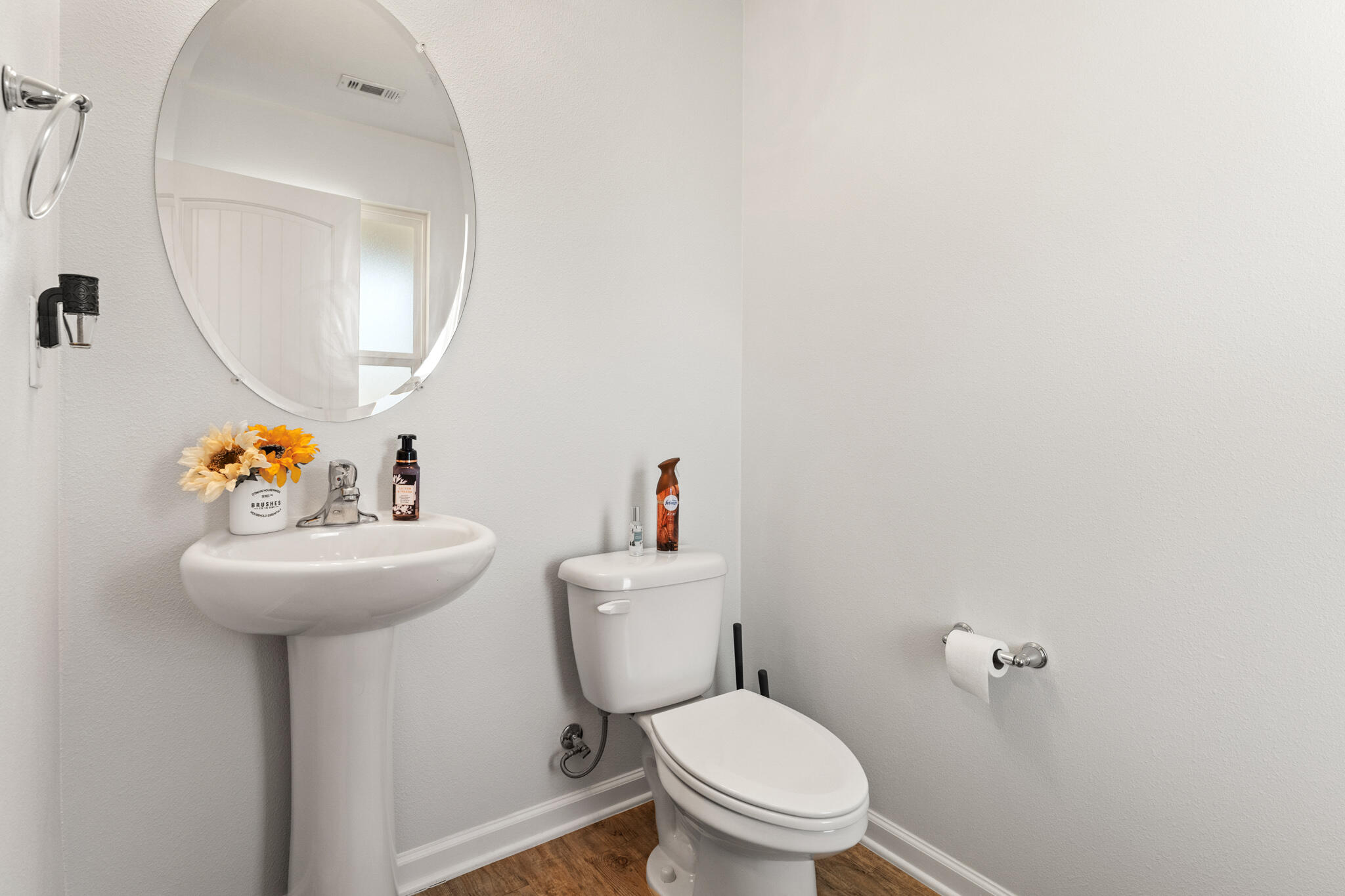 745 Widgeon Way Crestview, FL 32539 - Photo 12 of 29 a bathroom with a sink mirror and toilet