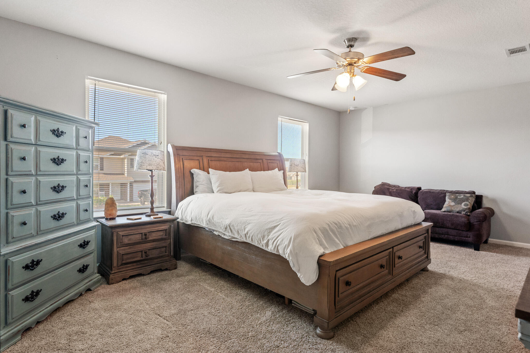 745 Widgeon Way Crestview, FL 32539 - Photo 14 of 29 a spacious bedroom with a bed and a ceiling fan