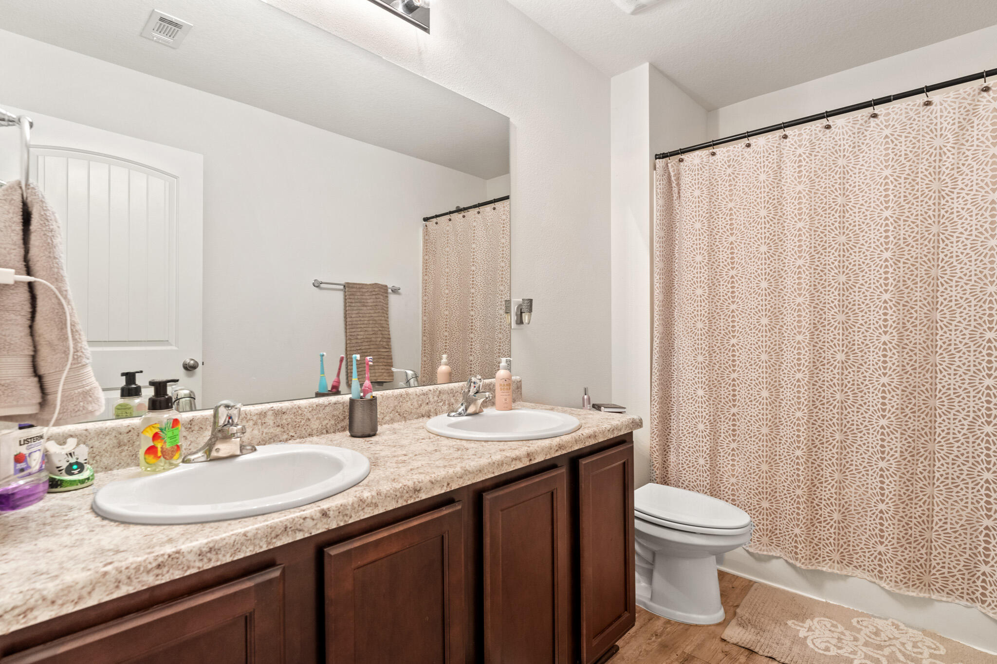 745 Widgeon Way Crestview, FL 32539 - Photo 25 of 29 a bathroom with double sink and a mirror