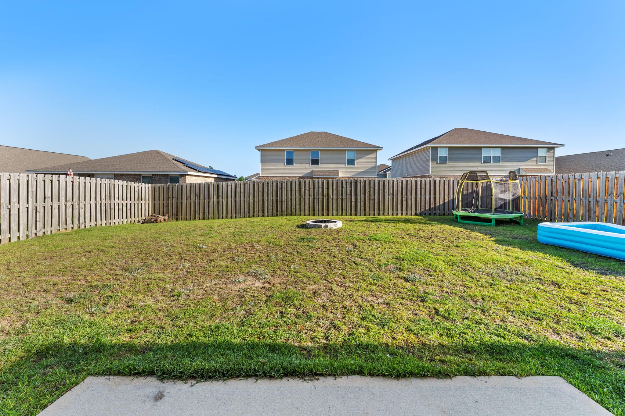 745 Widgeon Way Crestview, FL 32539 - Photo 27 of 29 a front view of a house with garden