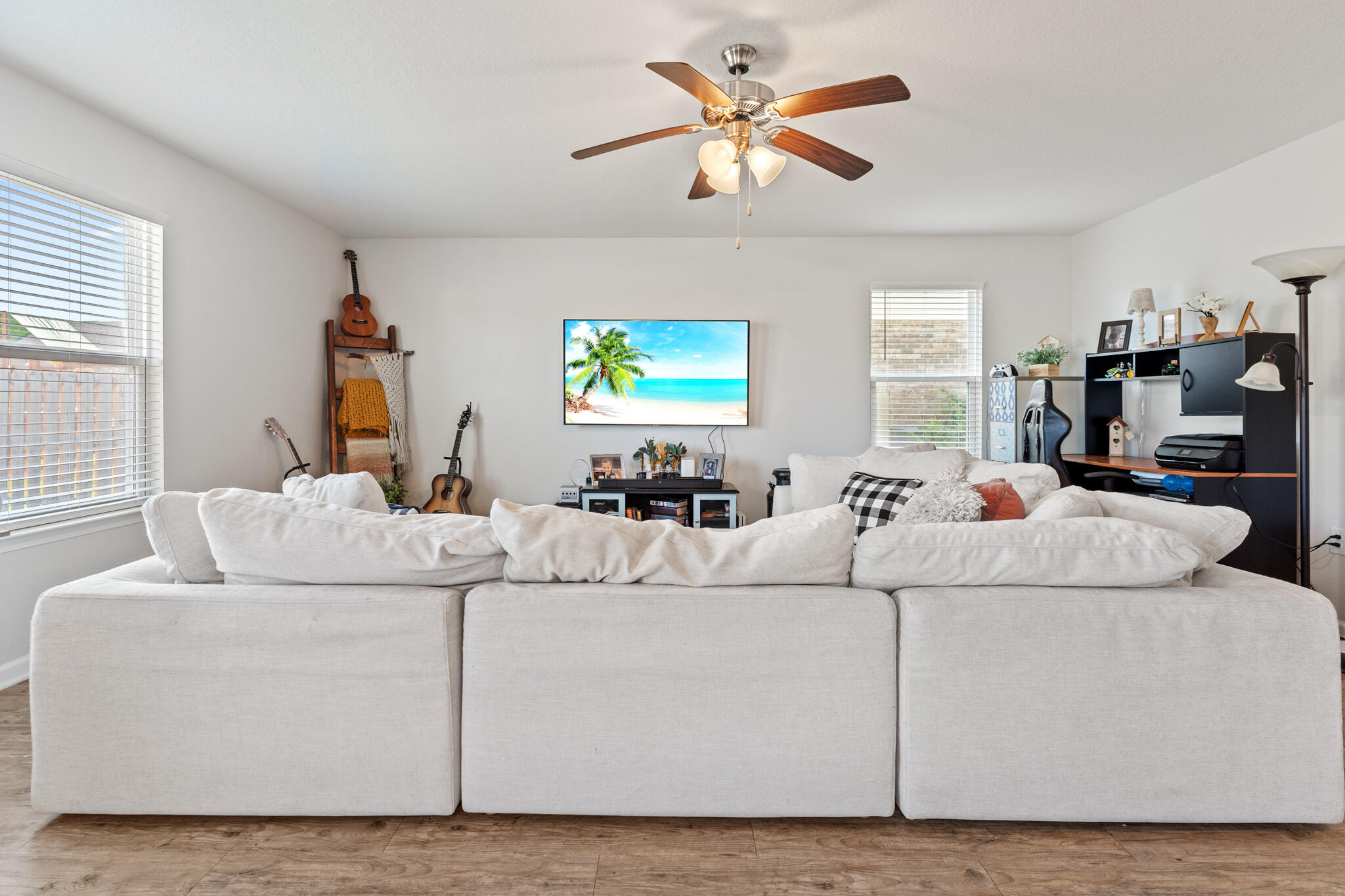 745 Widgeon Way Crestview, FL 32539 - Photo 5 of 29 a living room with furniture and a flat screen tv