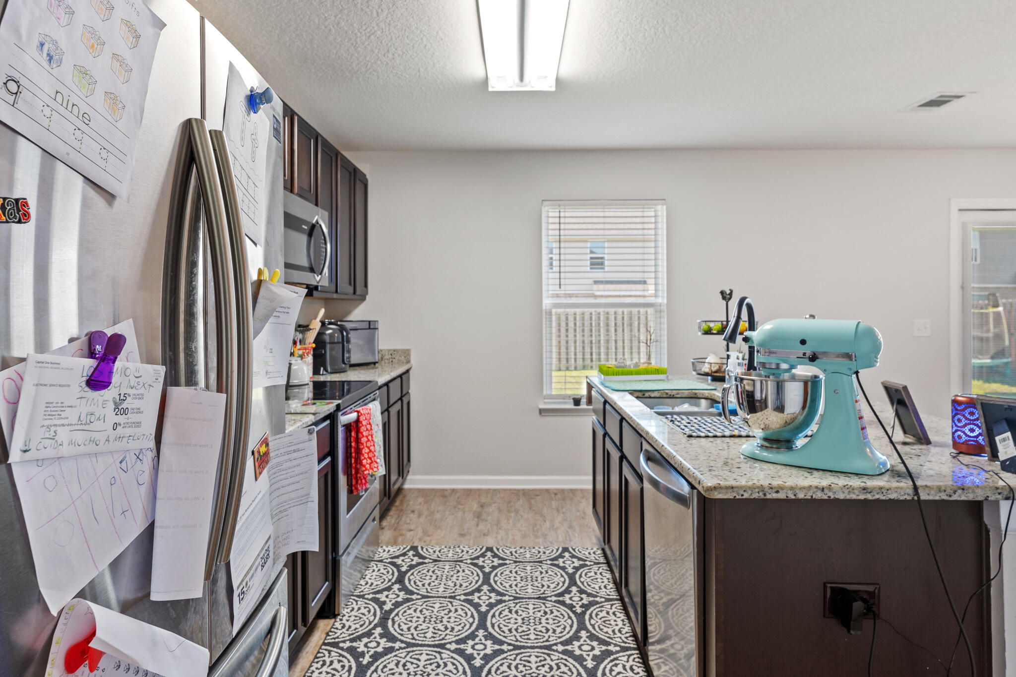 745 Widgeon Way Crestview, FL 32539 - Photo 8 of 29 a room with furniture a rug and gym equipment