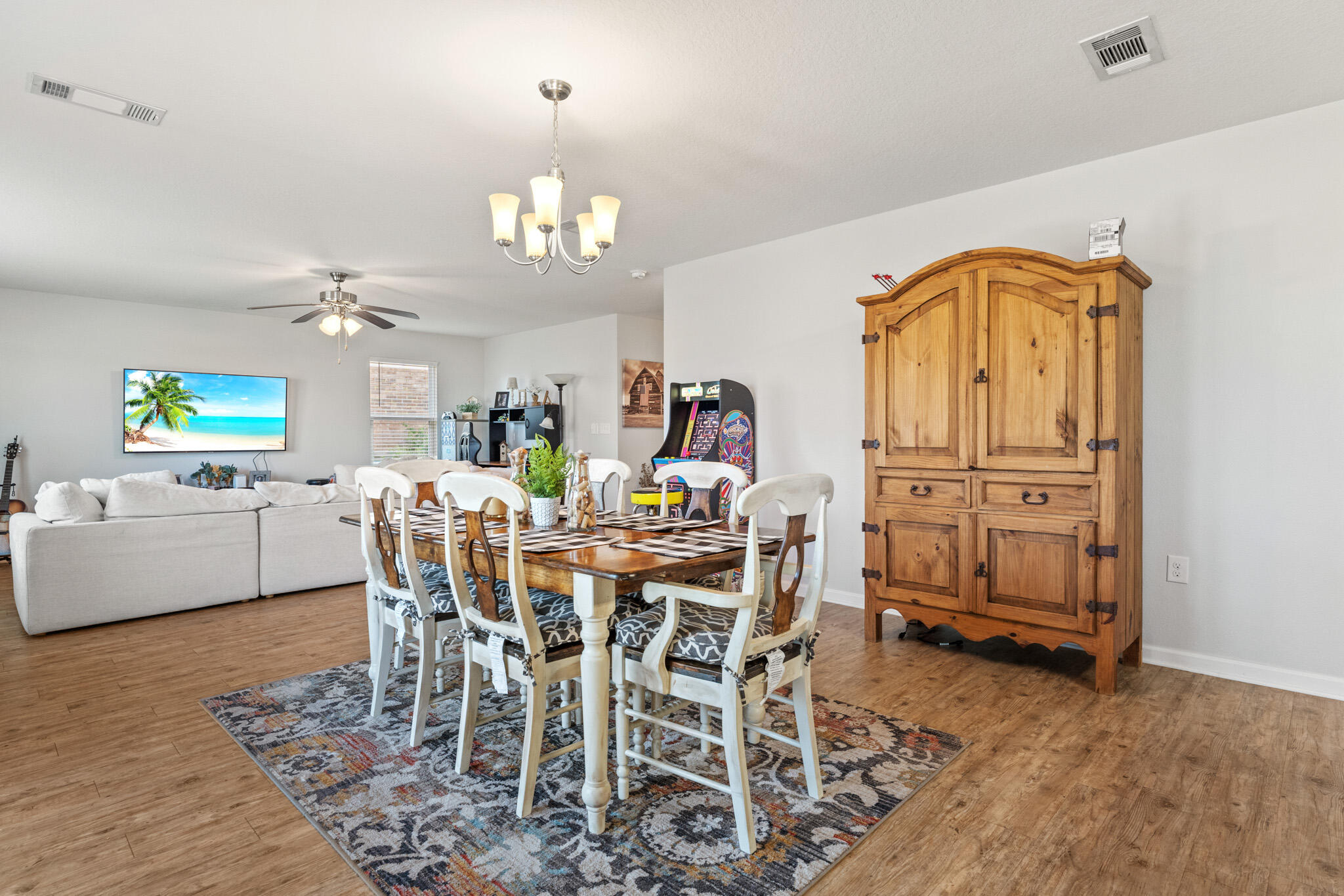745 Widgeon Way Crestview, FL 32539 - Photo 10 of 29 a view of a dining room with furniture window and wooden floor