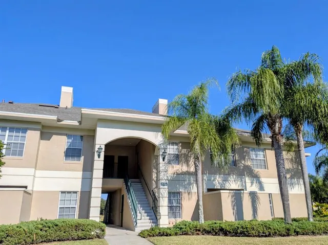 a view of a building with a tree