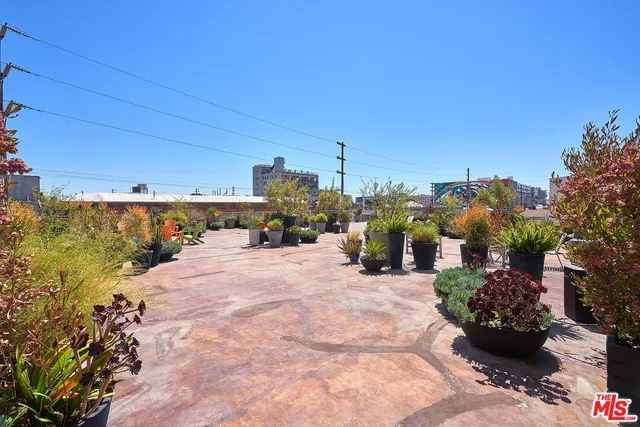 a view of a patio with furniture and a yard