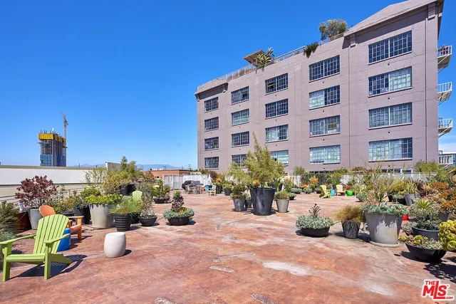 a view of a building with sitting area