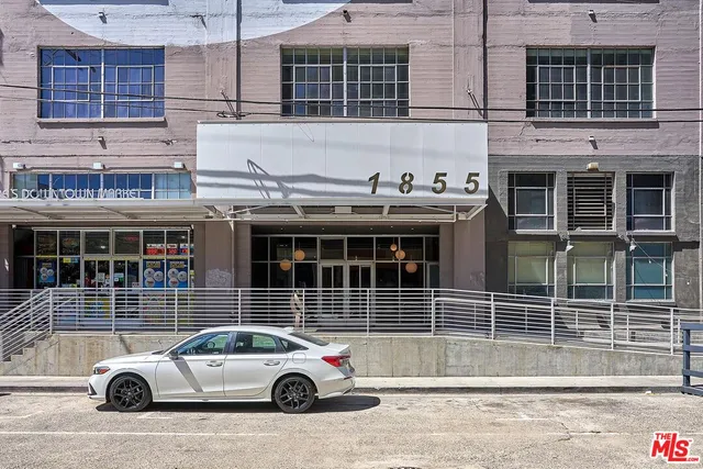 a view of a building with a street