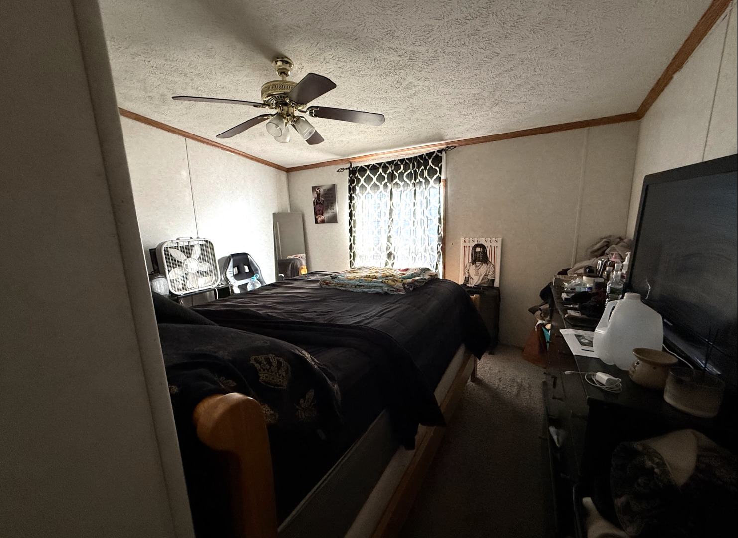 3404 Old Plank Road Park City, IL 60085 - Photo 14 of 20 a bed room with a bed mirror and a window