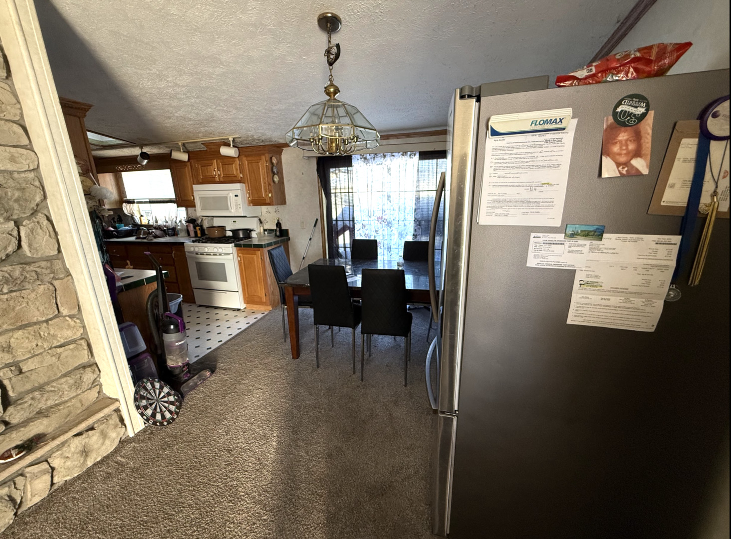 3404 Old Plank Road Park City, IL 60085 - Photo 5 of 20 a view of a dining room with furniture