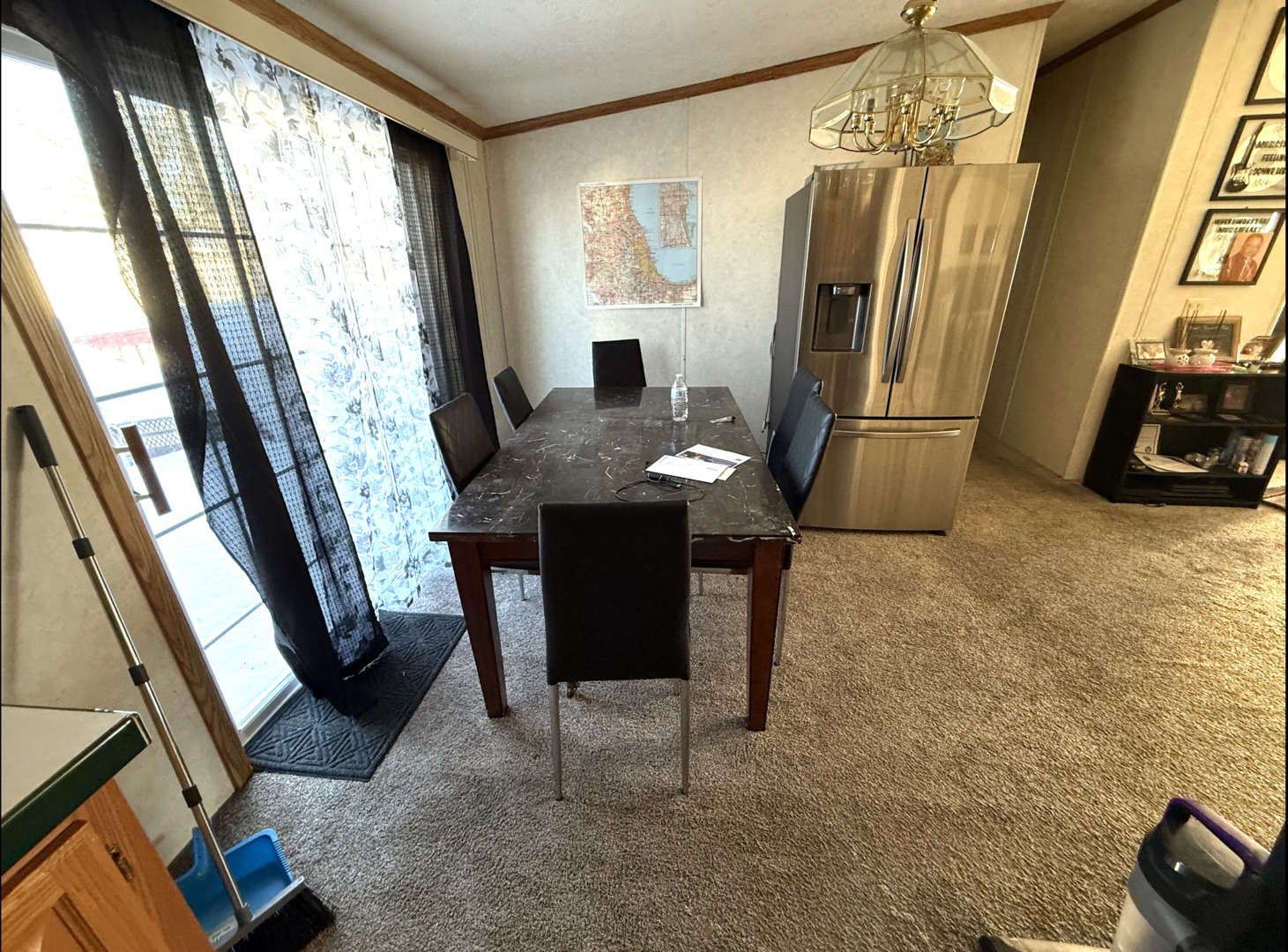 3404 Old Plank Road Park City, IL 60085 - Photo 6 of 20 a dining room with furniture a chandelier and wooden floor