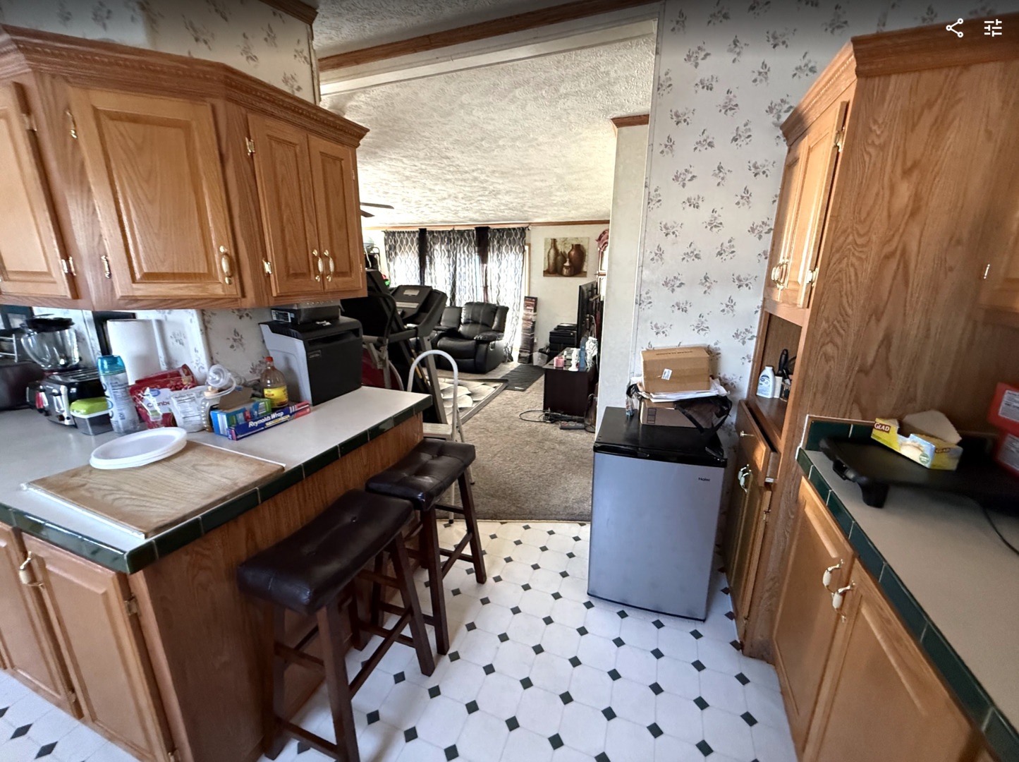 3404 Old Plank Road Park City, IL 60085 - Photo 7 of 20 a kitchen with a sink and wooden cabinets