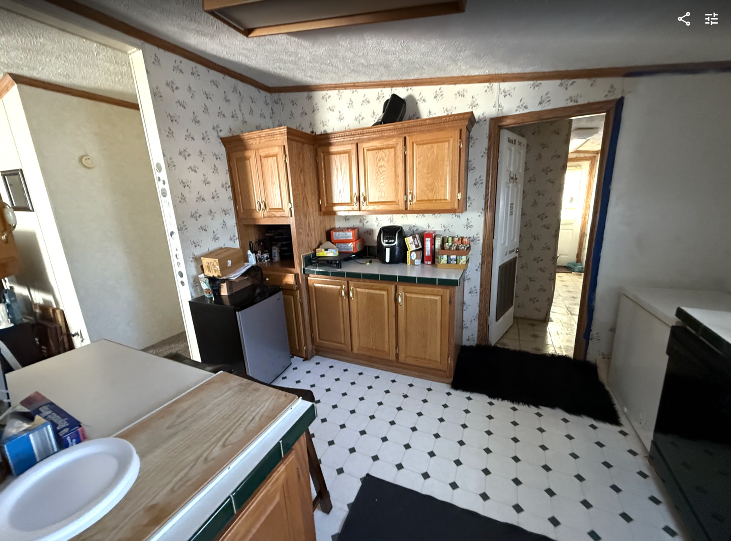 3404 Old Plank Road Park City, IL 60085 - Photo 8 of 20 a kitchen with a sink a stove a window and wooden floor