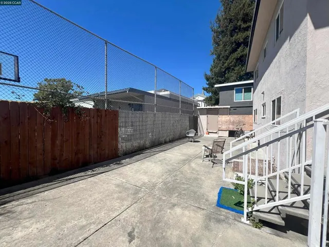 a view of a backyard with sitting area