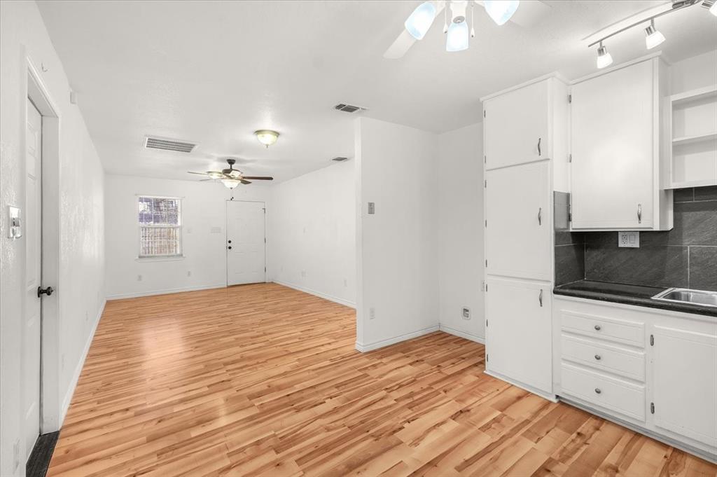 112 Del Rio Avenue, Unit A & B Benbrook, TX 76126 - Photo 13 of 33 a view of a kitchen with microwave and cabinets