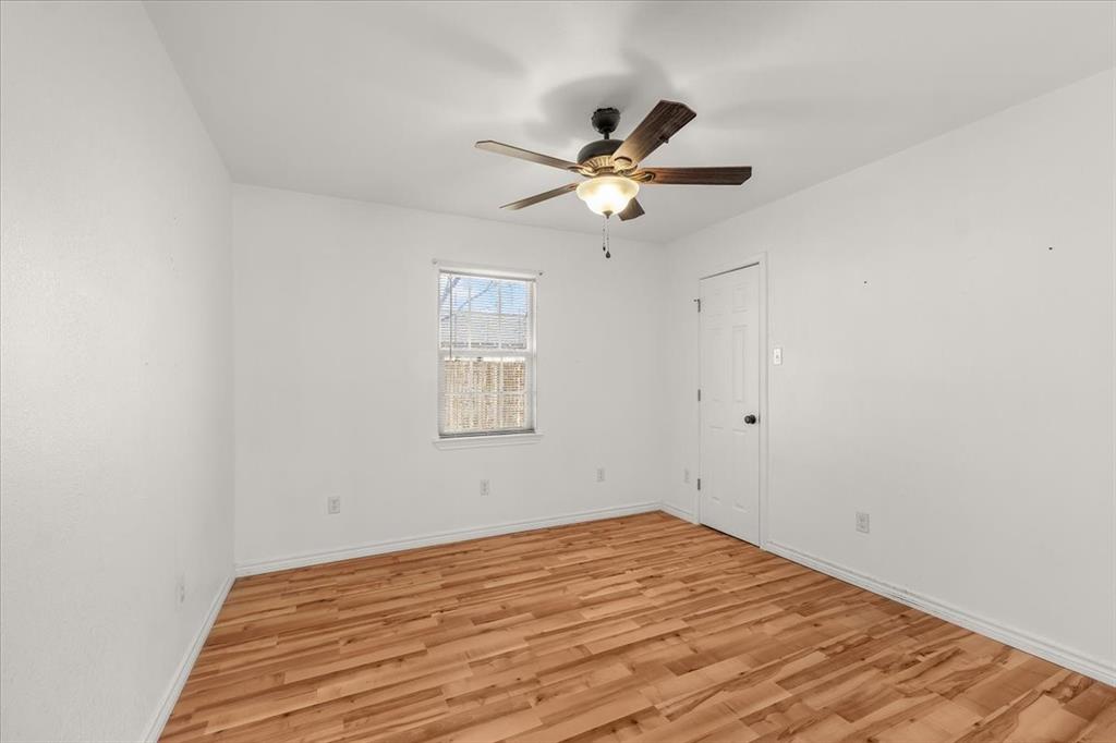 112 Del Rio Avenue, Unit A & B Benbrook, TX 76126 - Photo 14 of 33 a view of empty room with wooden floor and fan