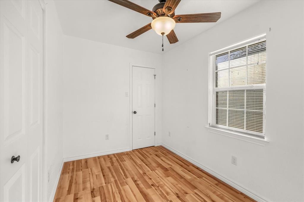 112 Del Rio Avenue, Unit A & B Benbrook, TX 76126 - Photo 18 of 33 a view of empty room with wooden floor and fan