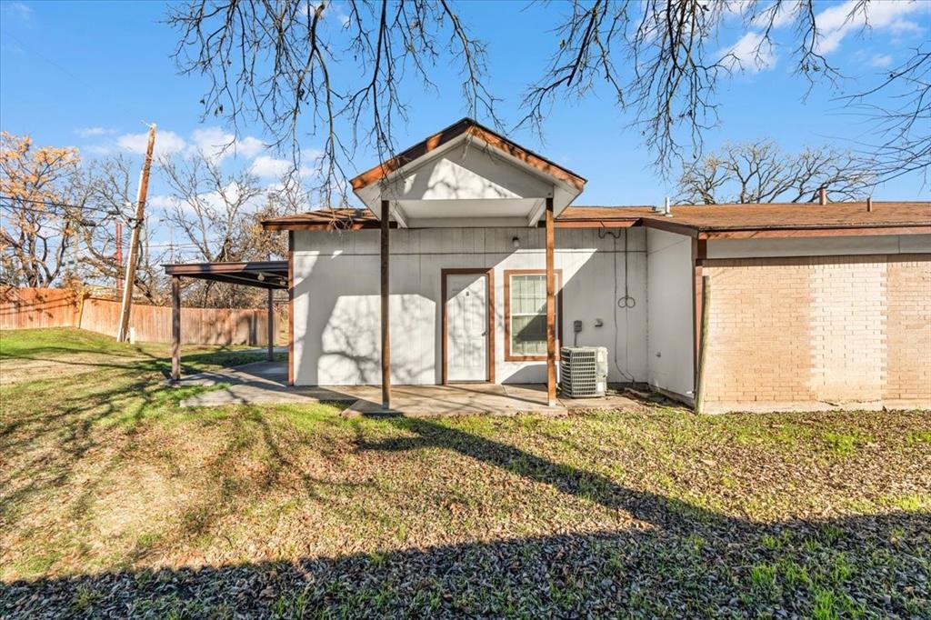 112 Del Rio Avenue, Unit A & B Benbrook, TX 76126 - Photo 21 of 33 a view of a house with a yard
