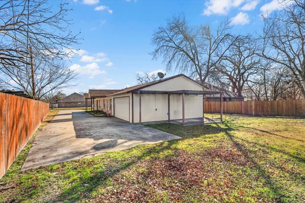 112 Del Rio Avenue, Unit A & B Benbrook, TX 76126 - Photo 22 of 33 a view of a yard with wooden fence