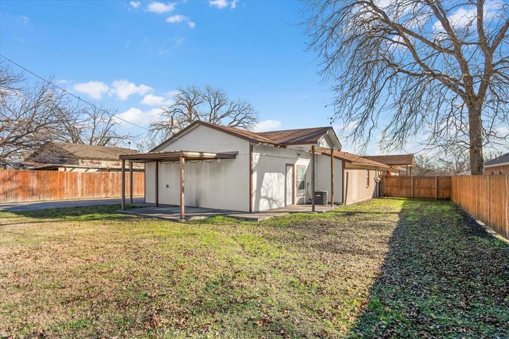112 Del Rio Avenue, Unit A & B Benbrook, TX 76126 - Photo 23 of 33 a large house with a big yard and large trees