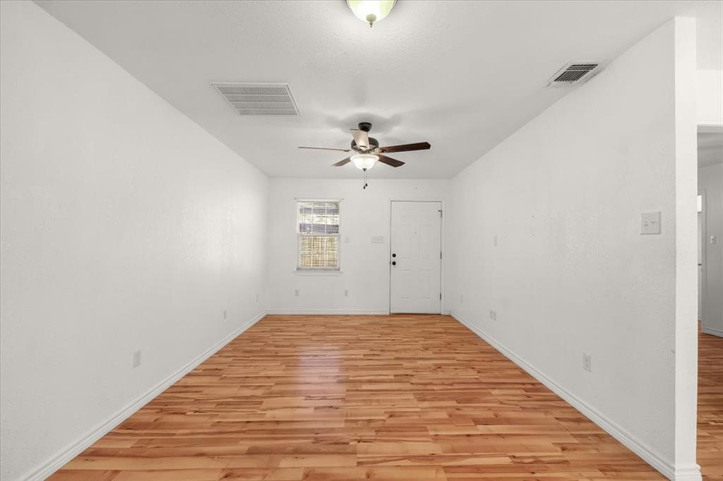 112 Del Rio Avenue, Unit A & B Benbrook, TX 76126 - Photo 7 of 33 an empty room with windows and fan