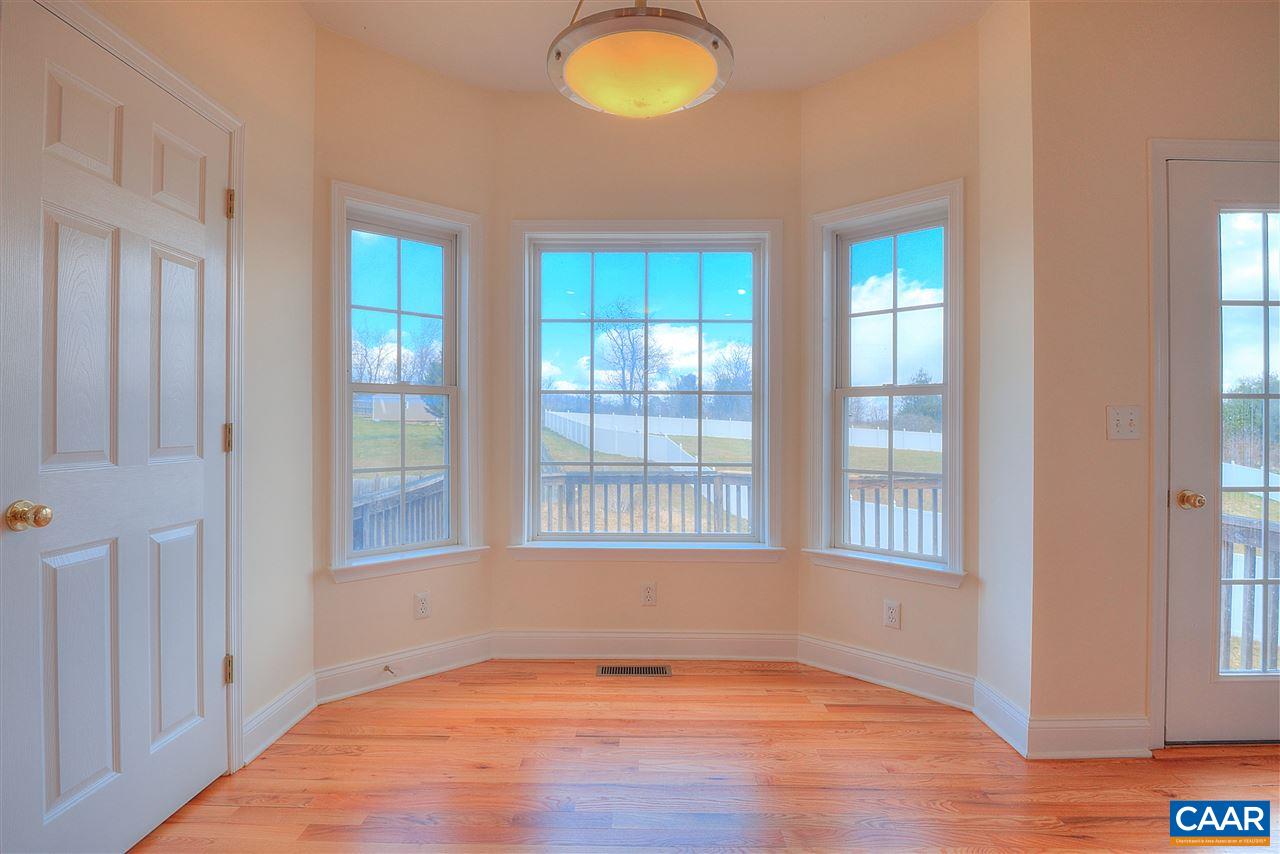 77 Oxford Road Fishersville, VA 22939 - Photo 8 of 28 a view of an empty room with wooden floor and a window