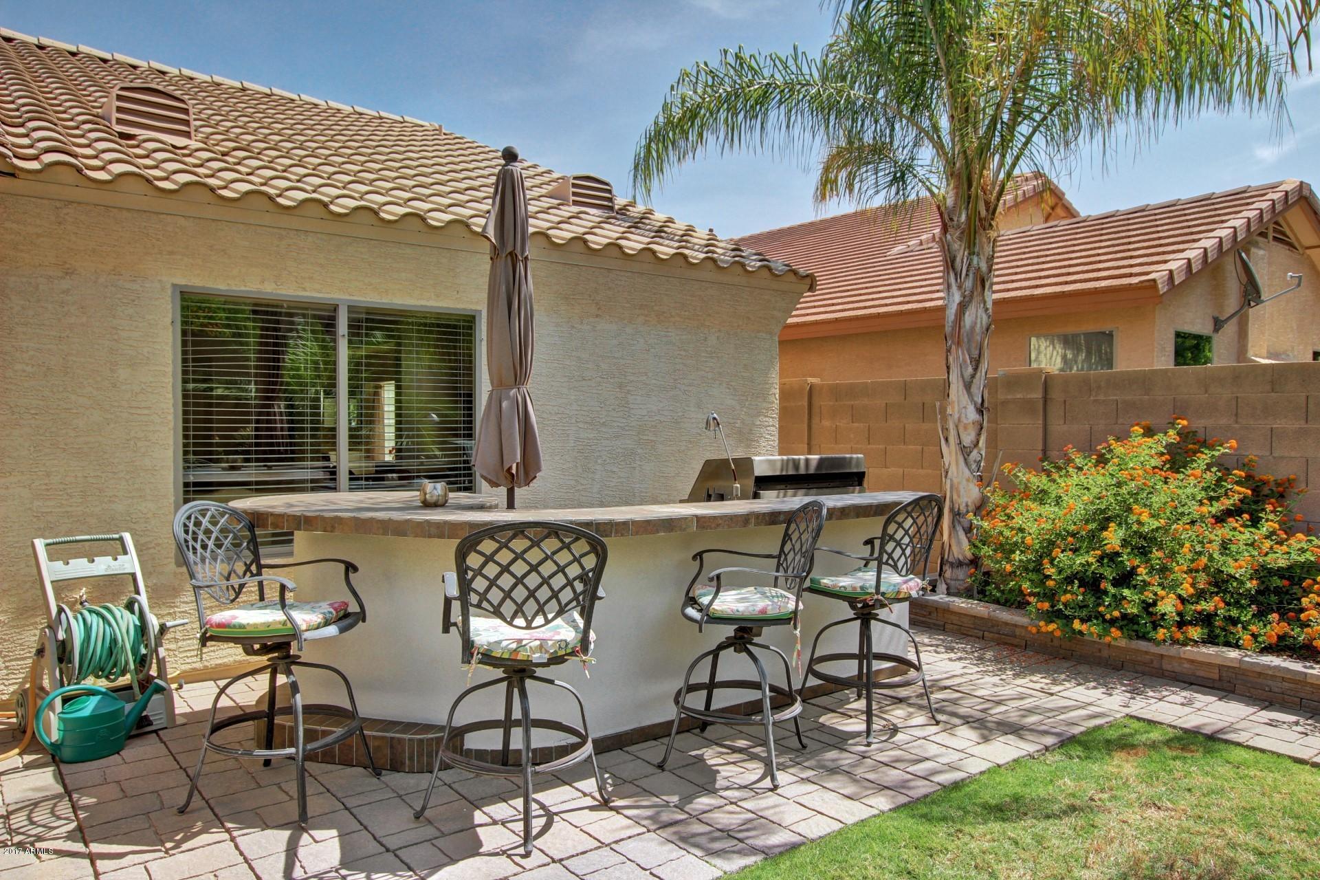 2111 West Caleb Road Phoenix, AZ 85085 - Photo 29 of 39 a view of a patio with table and chairs and potted plants