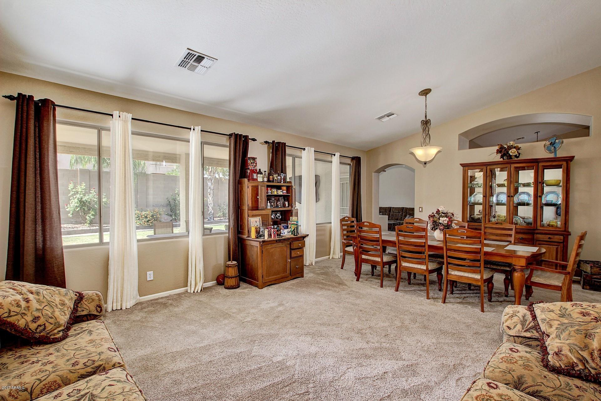 2111 West Caleb Road Phoenix, AZ 85085 - Photo 5 of 39 a view of a livingroom with furniture and window